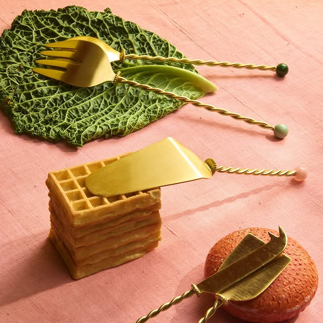 Bitossi Home Torchon gold salad serving set with twisted handles, 31cm, styled in a table setting