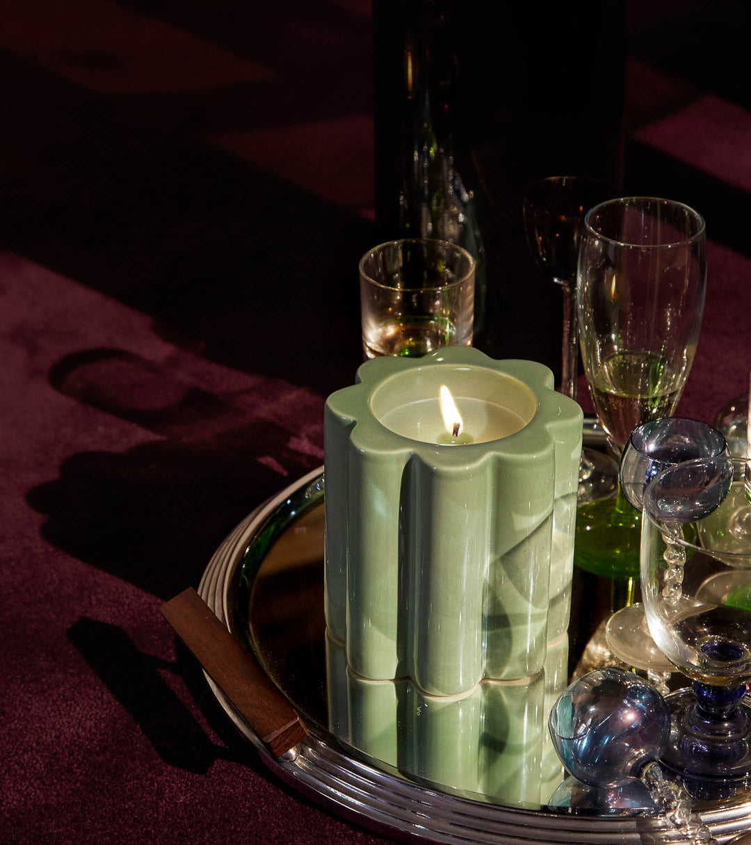 The Socialite Family Candela orange blossom scented candle in a green ceramic vessel, 240g, styled in a room setting 2
